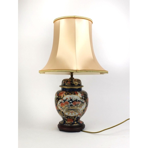 2286 - Oriental jar and cover table lamp, with peach silk shade, the jar decorated with flowers, 62cm high