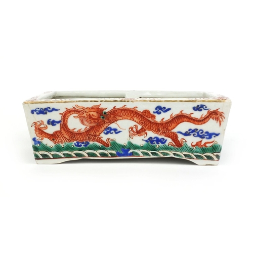 359 - Chinese rectangular porcelain planter, hand painted with dragons chasing the flaming pearl, six figu... 