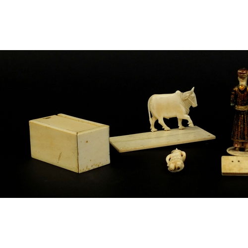 527 - Group of Indian ivory including a painted figure of a robed gentleman, rectangular box with slide li... 