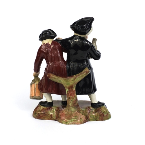 534 - 19th Century Staffordshire pottery spaniel inkwell, drunken figure group and a pair of leaf and berr... 