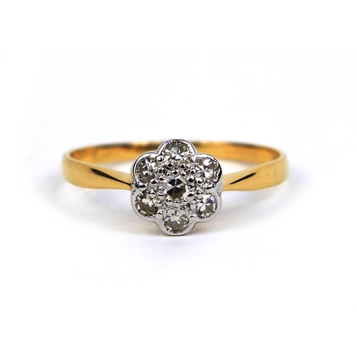 822 - 18ct gold diamond flower head ring set with seven diamonds, size T, approximate weight 2.2g