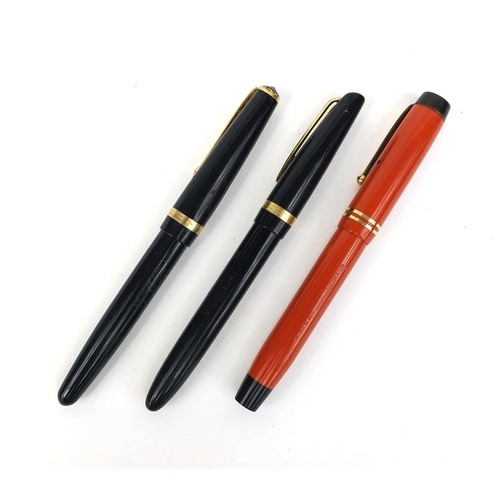 61 - Group of three vintage fountain pens comprising an orange Parker duofold, Conway Stewart 57 and a Wa... 
