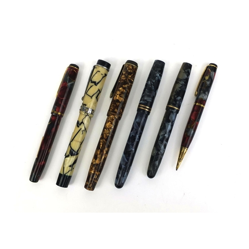 64 - Group of four vintage marbleised fountain pens together with a boxed Burnham red marbleised fountain... 