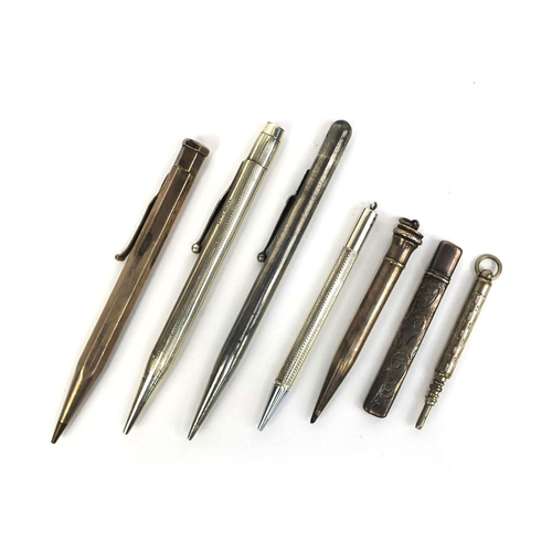 77 - Group of mostly silver propelling pencils and a silver pencil holder, the propelling pencils includi... 