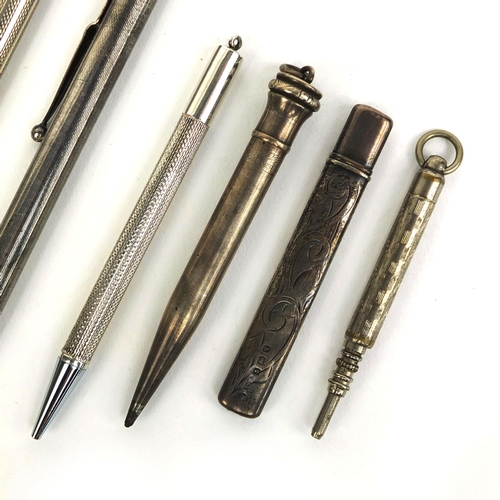 77 - Group of mostly silver propelling pencils and a silver pencil holder, the propelling pencils includi... 