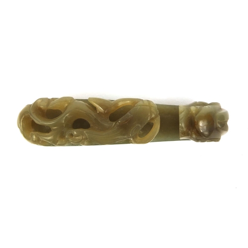 438 - Chinese green jade belt hook carved with a dragon, 8cm in length