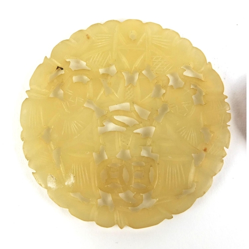 440 - Chinese circular jade pendant carved with two figures together with one other, the largest 6cm high