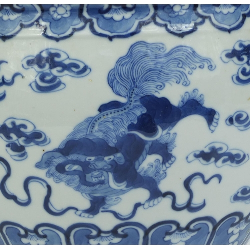 387 - Chinese blue and white porcelain jardinière, hand painted with kylin lions amongst clouds, four figu... 