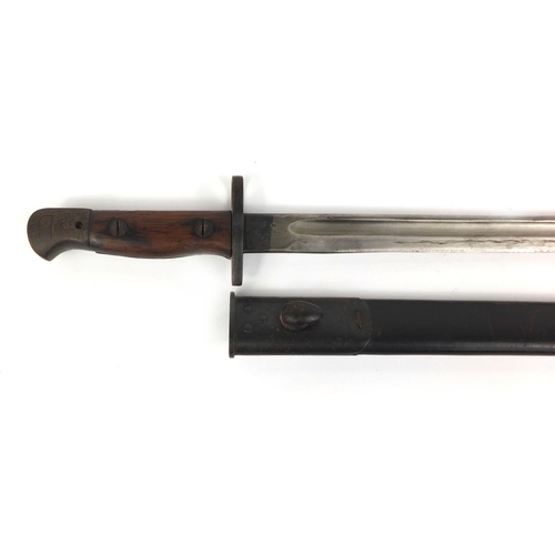 306 - Military interest World War I Wilkinson 1907 pattern bayonet, with wooden grip and leather scabbard,... 