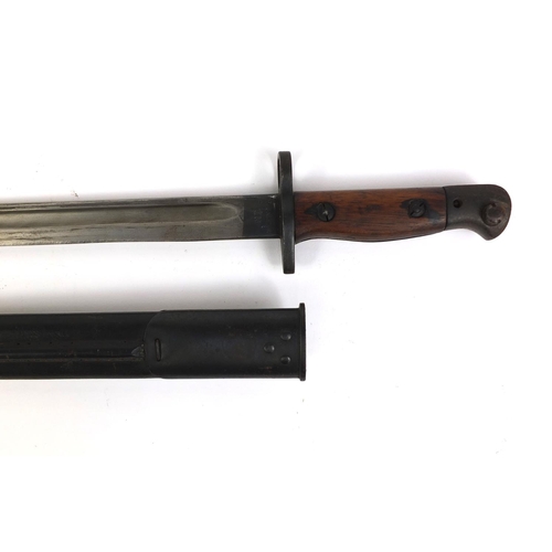 306 - Military interest World War I Wilkinson 1907 pattern bayonet, with wooden grip and leather scabbard,... 