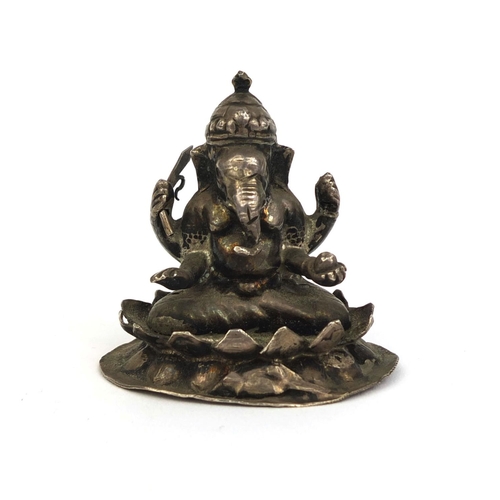 517 - Indian silver figure of Ganesh, impressed marks to the base, 5.3cm high