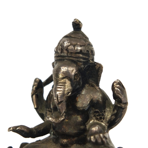 517 - Indian silver figure of Ganesh, impressed marks to the base, 5.3cm high