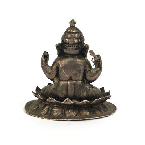 517 - Indian silver figure of Ganesh, impressed marks to the base, 5.3cm high