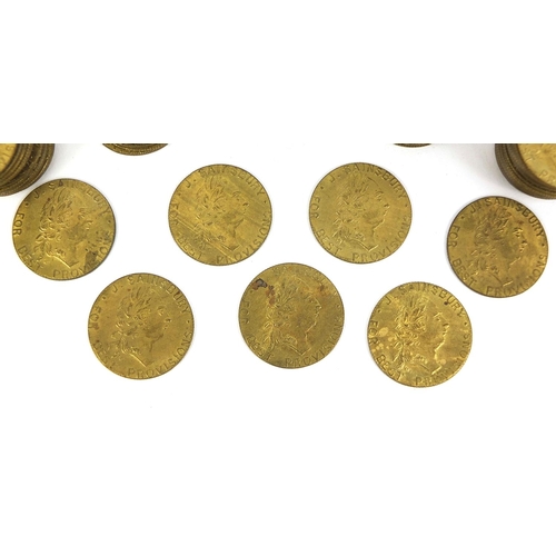 229 - Large collection of 18th century brass gaming tokens, each 2.5cm in diameter