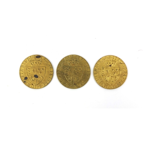 229 - Large collection of 18th century brass gaming tokens, each 2.5cm in diameter