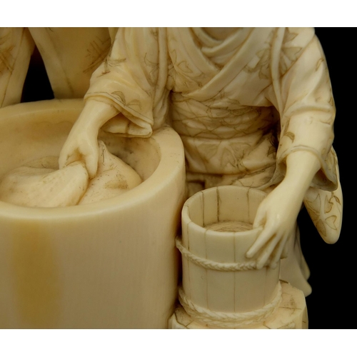 456 - Well detailed Japanese carved ivory okimono of a man and lady washing, character marks to the base, ... 