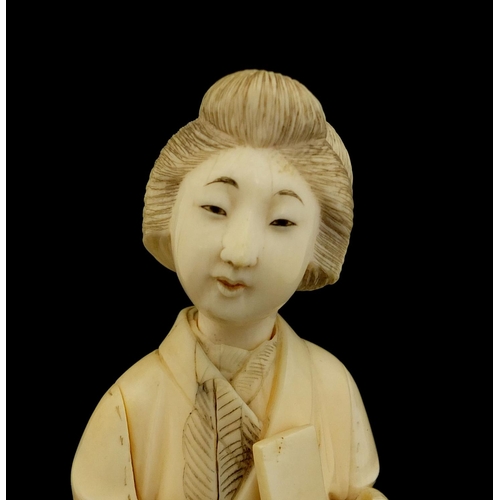 461 - Japanese carved ivory okimono of a girl holding a comb, red inset character marks to the base, 17cm ... 