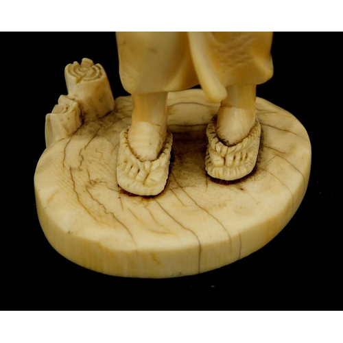 457 - Japanese carved ivory okimono of a mother holding her baby and grapes, character marks to the base, ... 