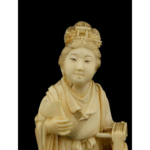 458 - Japanese carved ivory okimono of a lady holding a musical instrument, 12cm high