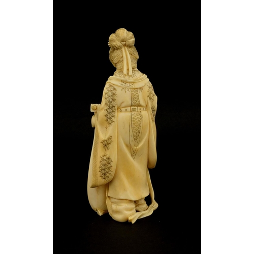 458 - Japanese carved ivory okimono of a lady holding a musical instrument, 12cm high