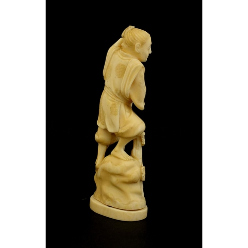 460 - Japanese carved ivory okimono of a man holding a bucket and rake, character marks to the base, 15.5c... 