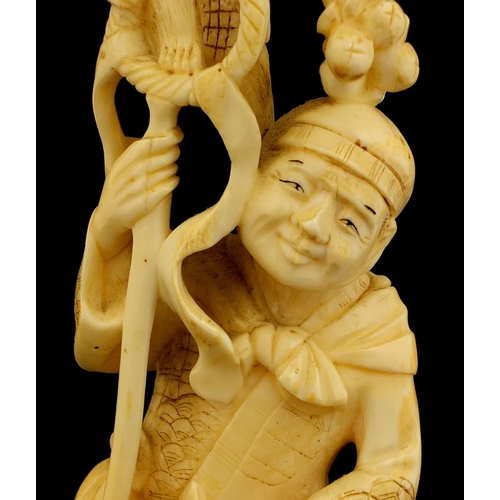 459 - Japanese carved ivory okimono of a man and monkey, red inset character marks to the base, 19.5cm hig... 