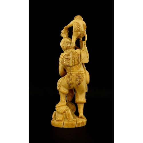 459 - Japanese carved ivory okimono of a man and monkey, red inset character marks to the base, 19.5cm hig... 