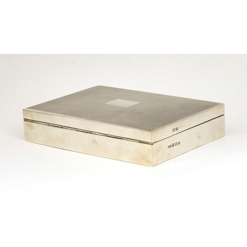 672 - Rectangular silver cigar box, the lid with engine turned decoration, S & M Birmingham 1978, 16cm lon... 