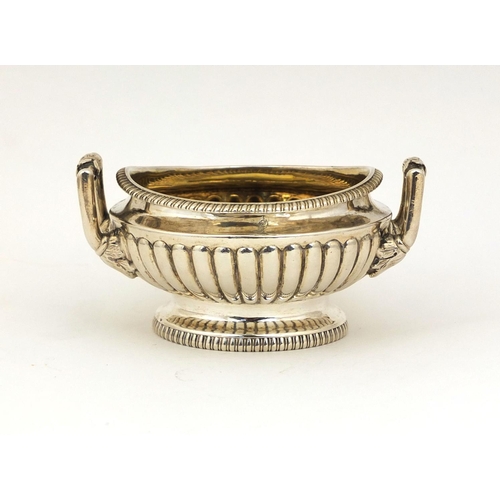 666 - Georgian silver twin handled open salt with demi fluted decoration, D.P London 1805, 8.5cm in diamet... 