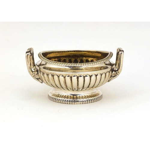 666 - Georgian silver twin handled open salt with demi fluted decoration, D.P London 1805, 8.5cm in diamet... 