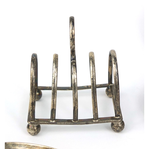 707 - Silver items comprising four slice toast rack, pair of salt and pepper shakers, three spoons and a b... 