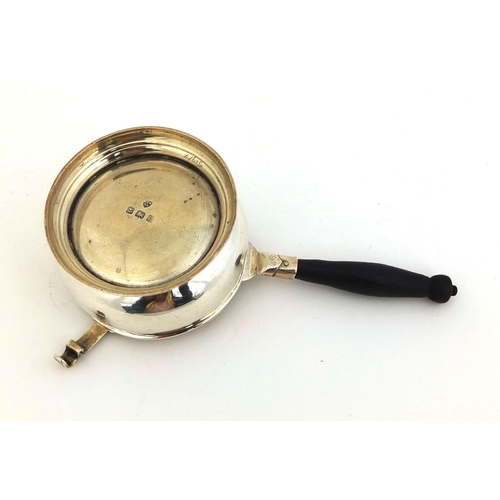 697 - Silver tea strainer with ebonised wooden handle and a matched silver stand,  hallmarked Birmingham 1... 