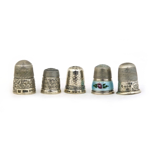 708 - Five silver thimbles, one with enamelled floral decoration, various hallmarks, approximate weight 22... 