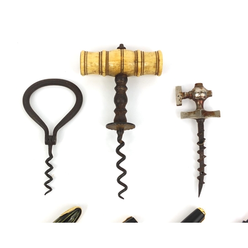 83 - Group of objects including a 19th century bone handled straight pull corkscrew and four fountain pen... 