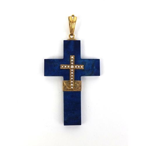 821 - Gold mounted Lapis Lazuli cross pendant set with seed pearls, impressed eagles head mark to the susp... 