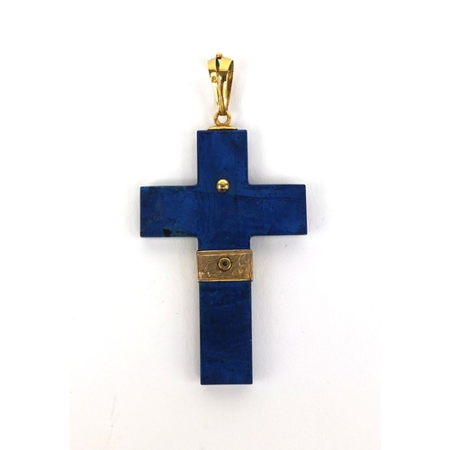 821 - Gold mounted Lapis Lazuli cross pendant set with seed pearls, impressed eagles head mark to the susp... 