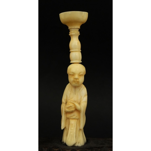 451 - Chinese carved ivory and wooden puzzle ball stand, the central figure flanked by pair of floral carv... 