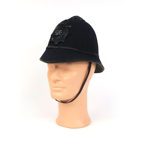 317 - Vintage Metropolitan police six panel helmet, of rose top design with badge, 21cm high