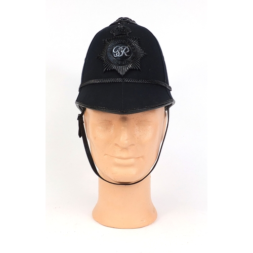 317 - Vintage Metropolitan police six panel helmet, of rose top design with badge, 21cm high