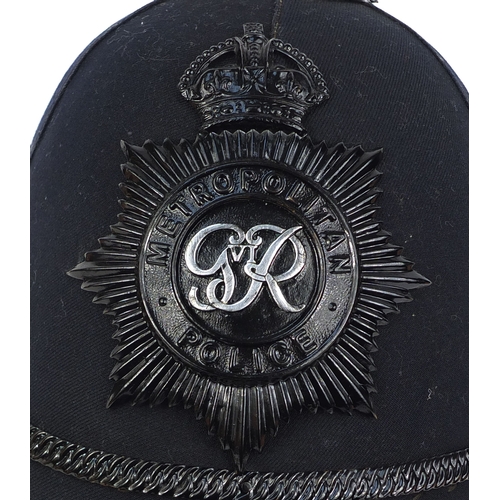 317 - Vintage Metropolitan police six panel helmet, of rose top design with badge, 21cm high