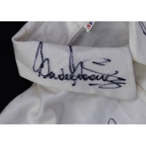 142 - EGCC Cricket shirt signed by various sports personalities, including Pelé, Gordon Bank, Shane Warne,... 