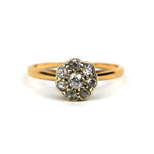 833 - Unmarked diamond flower head ring set with eight solitaire diamonds, size O, approximate weight 2.3g