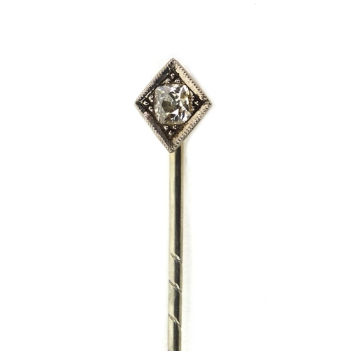 832 - Unmarked white metal diamond solitaire tie pin, 6cm long, approximate weight 2.8g