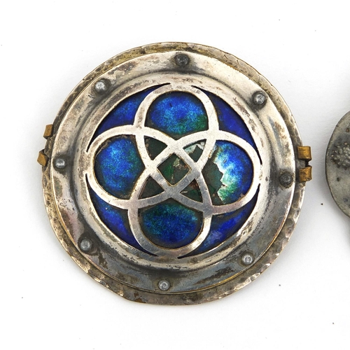 646 - Two Arts & Crafts Celtic style brooches, including an enamelled example by Cambray, the largest 5.5c... 