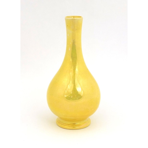 623 - Moorcroft pottery high fired yellow glazed bottle vase, factory marks to the base, 15cm high