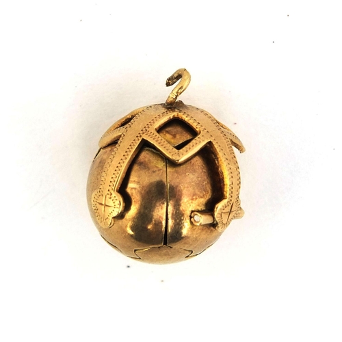 235 - Gold coloured metal and silver Masonic ball pendant, opening to form a cross with various symbols, 2... 