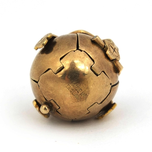 235 - Gold coloured metal and silver Masonic ball pendant, opening to form a cross with various symbols, 2... 