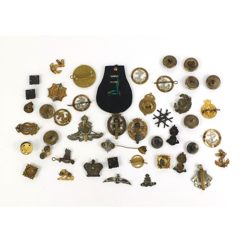 280 - Collection of British Military Naval interest cap badges and pips, together with a Christmas 1914 br... 