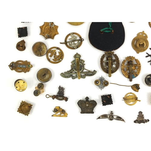 280 - Collection of British Military Naval interest cap badges and pips, together with a Christmas 1914 br... 