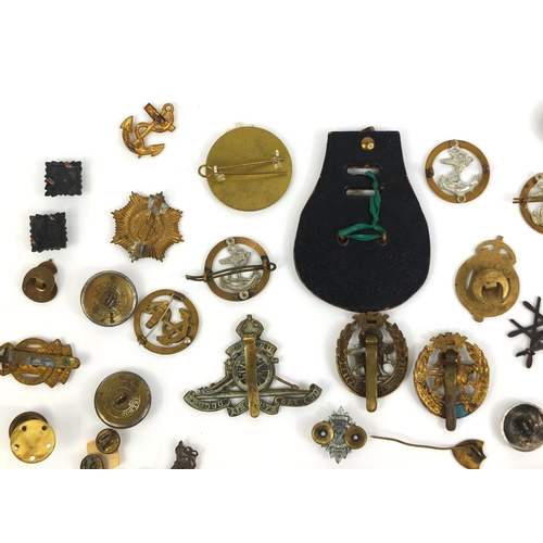 280 - Collection of British Military Naval interest cap badges and pips, together with a Christmas 1914 br... 